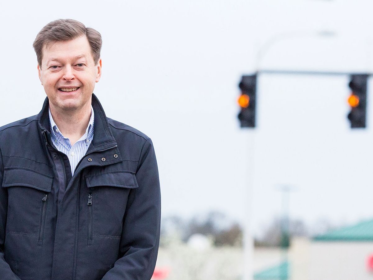 Mats Järlström’s stands in front of traffic lights at the intersection of Allen Boulevard and Lombard Avenue in Beaverton, Oregon.