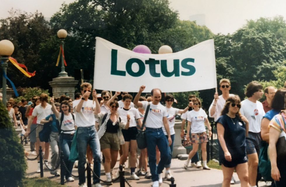 Matt Stern and his Lotus colleagues walk in the first Boston AIDS Walk with a Lotus banner.