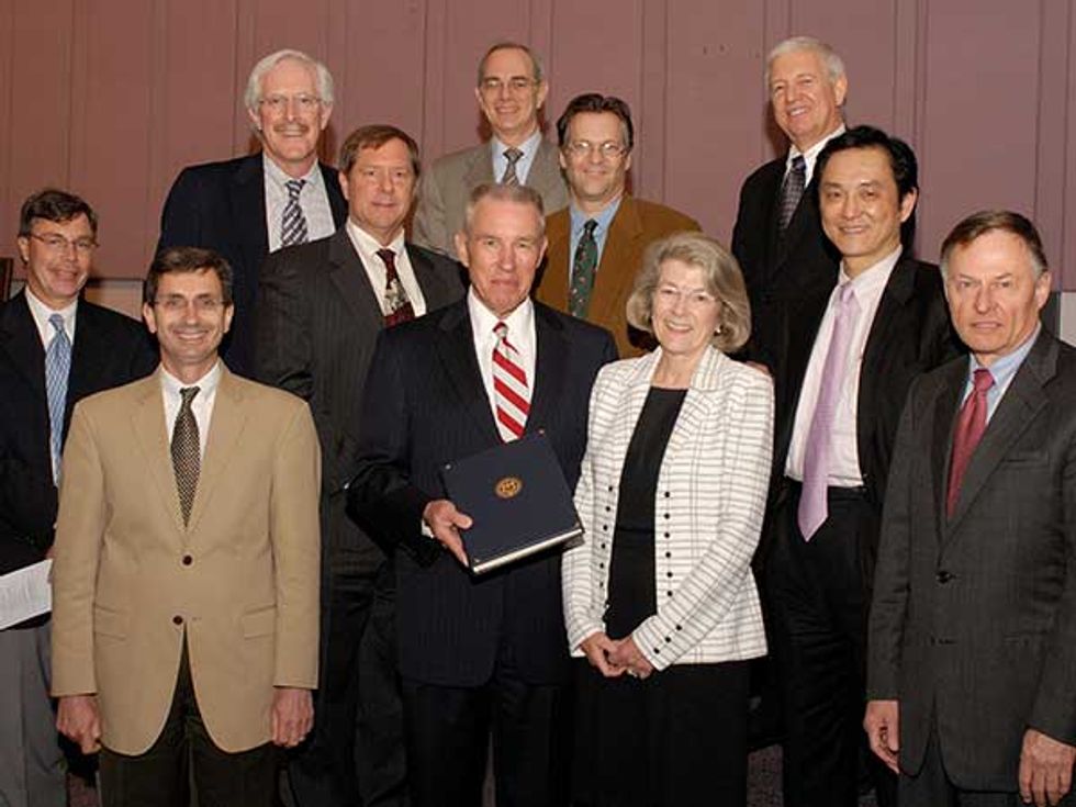 Meindl and several of his former Ph.D. students at the 2006 Honors Ceremony. (clockwise from top left): Ernie Wood, Rafael Reif, Levy Gerzberg, Fred Shapiro, Steve Combs, John Schott, Sharbel Noujaim, James Meindl, Freddy Meindl, Nicky Lu, and Jim Plummer