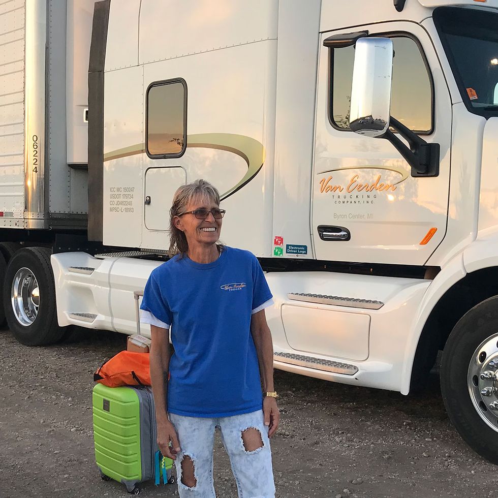 Michelle Kitchin at the Richard Crane Memorial Truck Show in St. Ignace, Michigan, in September 2018, with the truck she drives for Van Eerden Trucking Co., a 2018 Peterbilt 579 (10-speed automatic). 