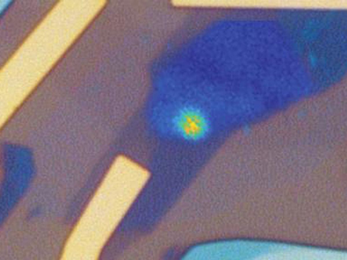 Microscope image of a quantum LED device shows bright quantum emitter generating a stream of single photons.