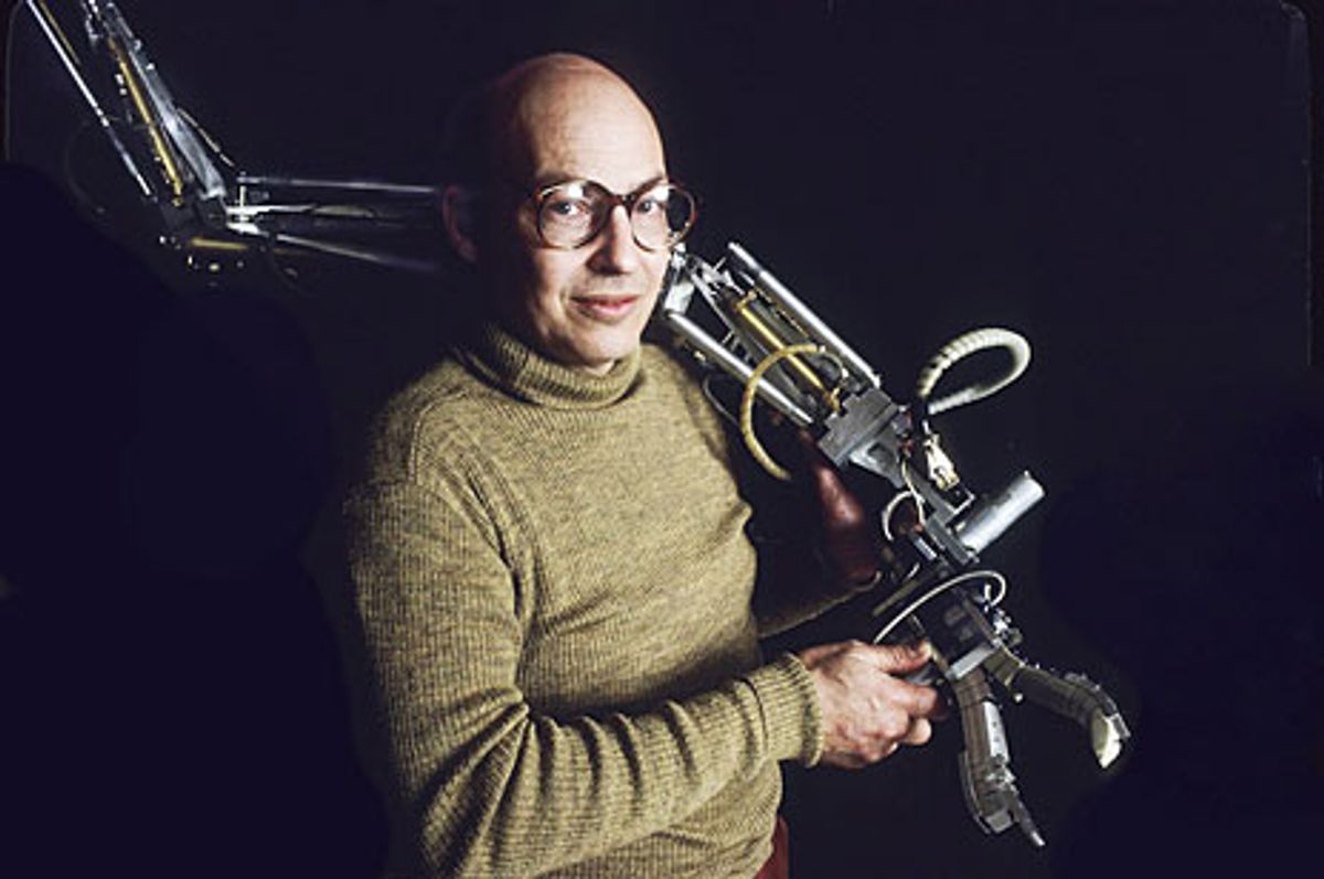 Mind and Machine: Marvin Minsky holds a 14-jointed, three-elbowed, computer-controlled, hydraulically muscled mechanical arm