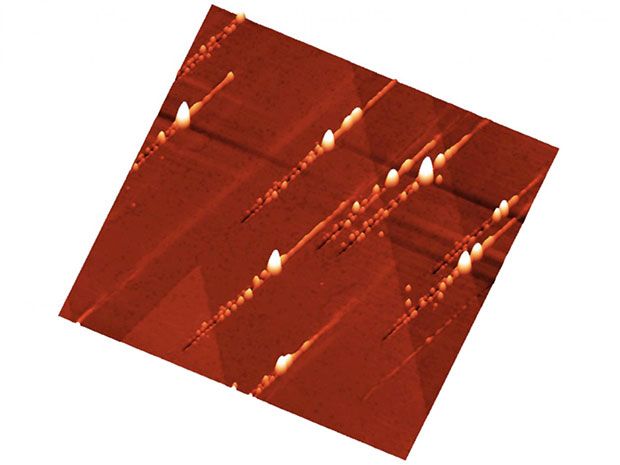 Nanostructures on a crystal after ion bombardment: Trenches with nanohillocks on either side are created.
