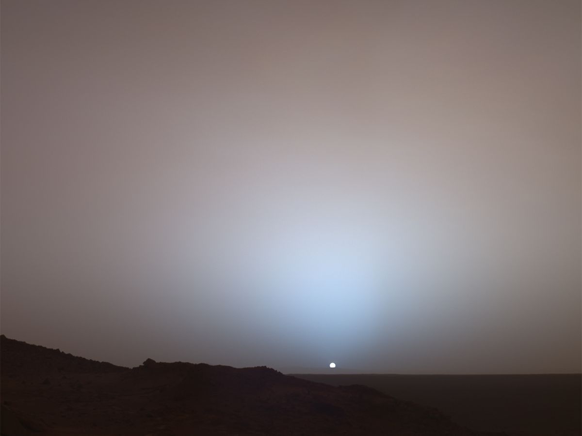 NASA's Mars Exploration Rover Spirit captured this stunning view as the Sun sank below the rim of Gusev crater on Mars, May 19th, 2005.