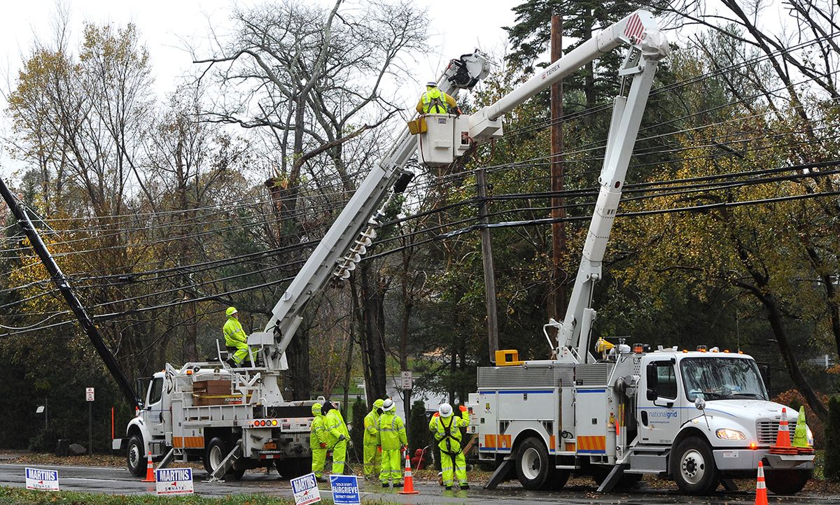 National Grid workers repair power lines damaged during Superstorm Sandy in Port Washington, N.Y., Nov. 7, 2012.
