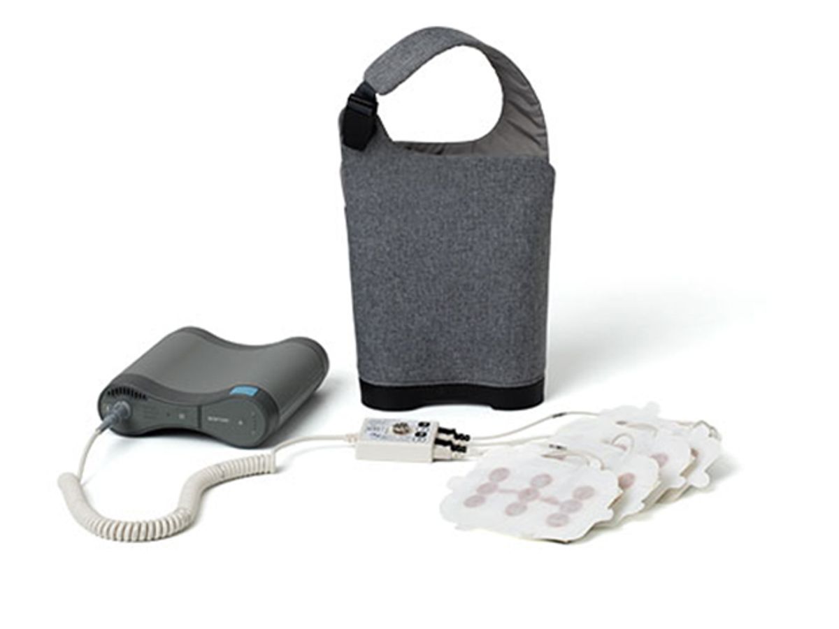 Novocure's gear for treating brain cancer with electric fields includes adhesive electrode patches and a battery pack.