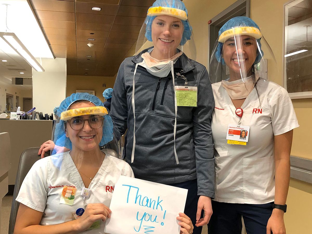 Nurses posed for this photo as a thank you to the volunteers that hand-made and delivered the face shields for them.
