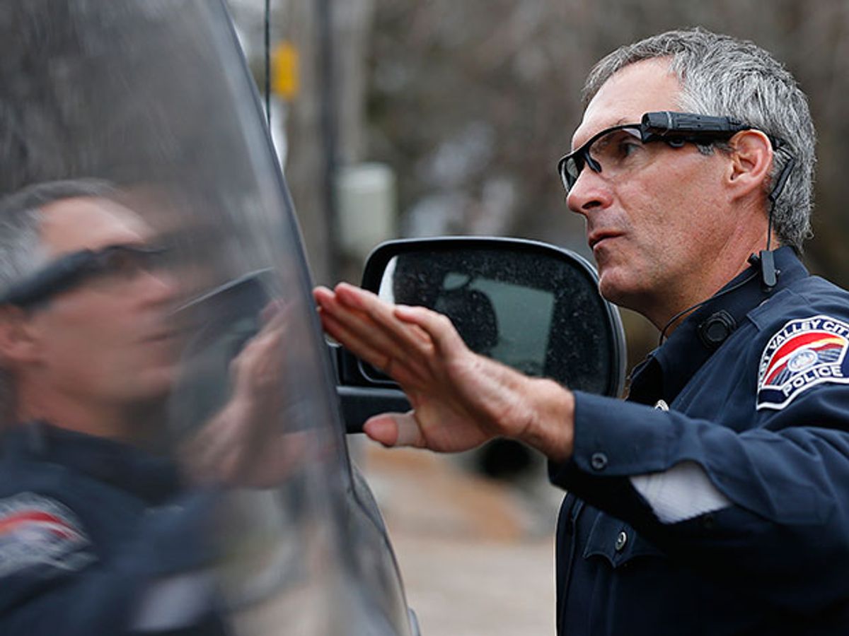 Officer at a traffic stop wearing camera attached to his glasses