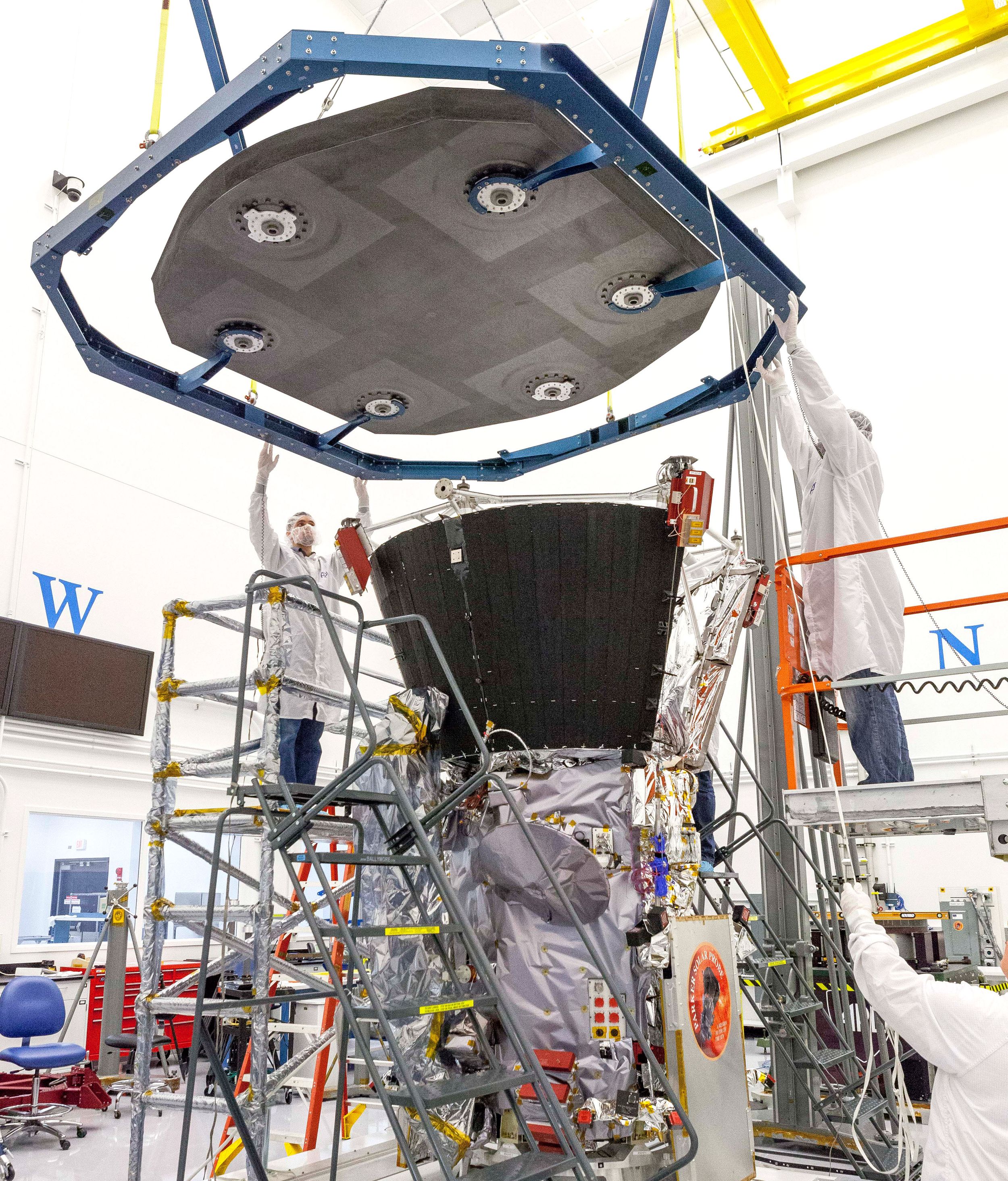 On Sept. 21, 2017, engineers at the Johns Hopkins University Applied Physics Laboratory in Laurel, Maryland, lowered the thermal protection system – the heat shield – onto the spacecraft for a test of alignment as part of integration and testing.