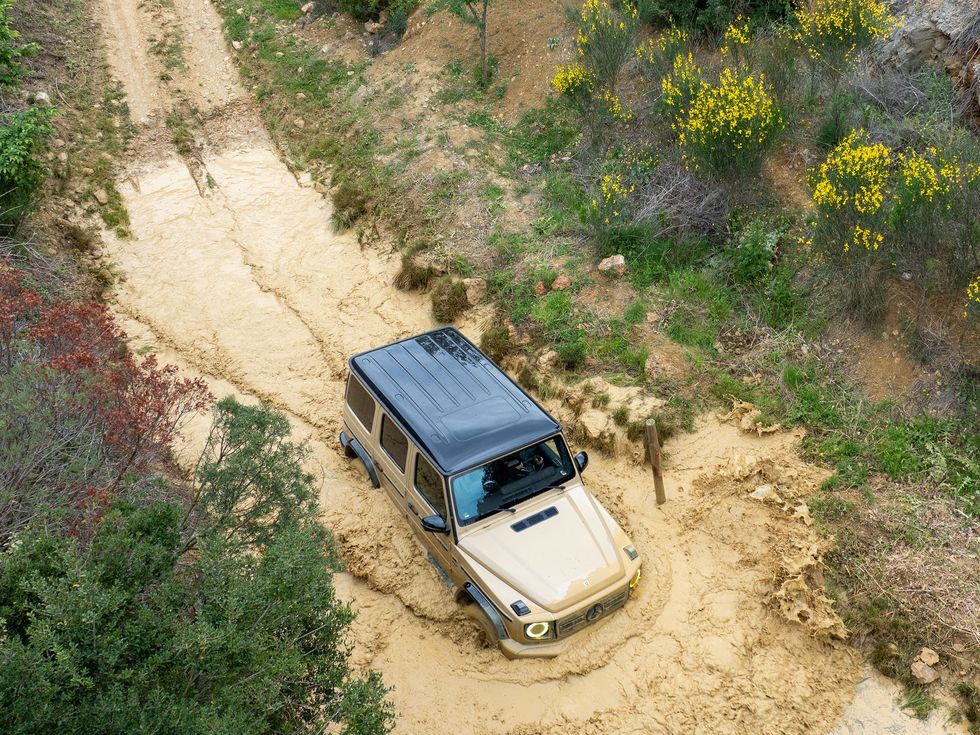 overhead view of an SUV going through muddy waters