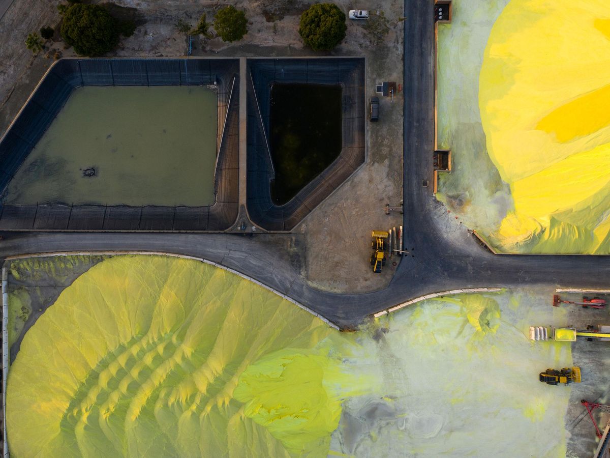 overhead view of mounds of yellow pelletized sulfur
