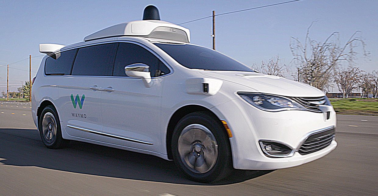 Pacifica Hybrid minivan driving on Waymo's test track in California for illustrative purposes