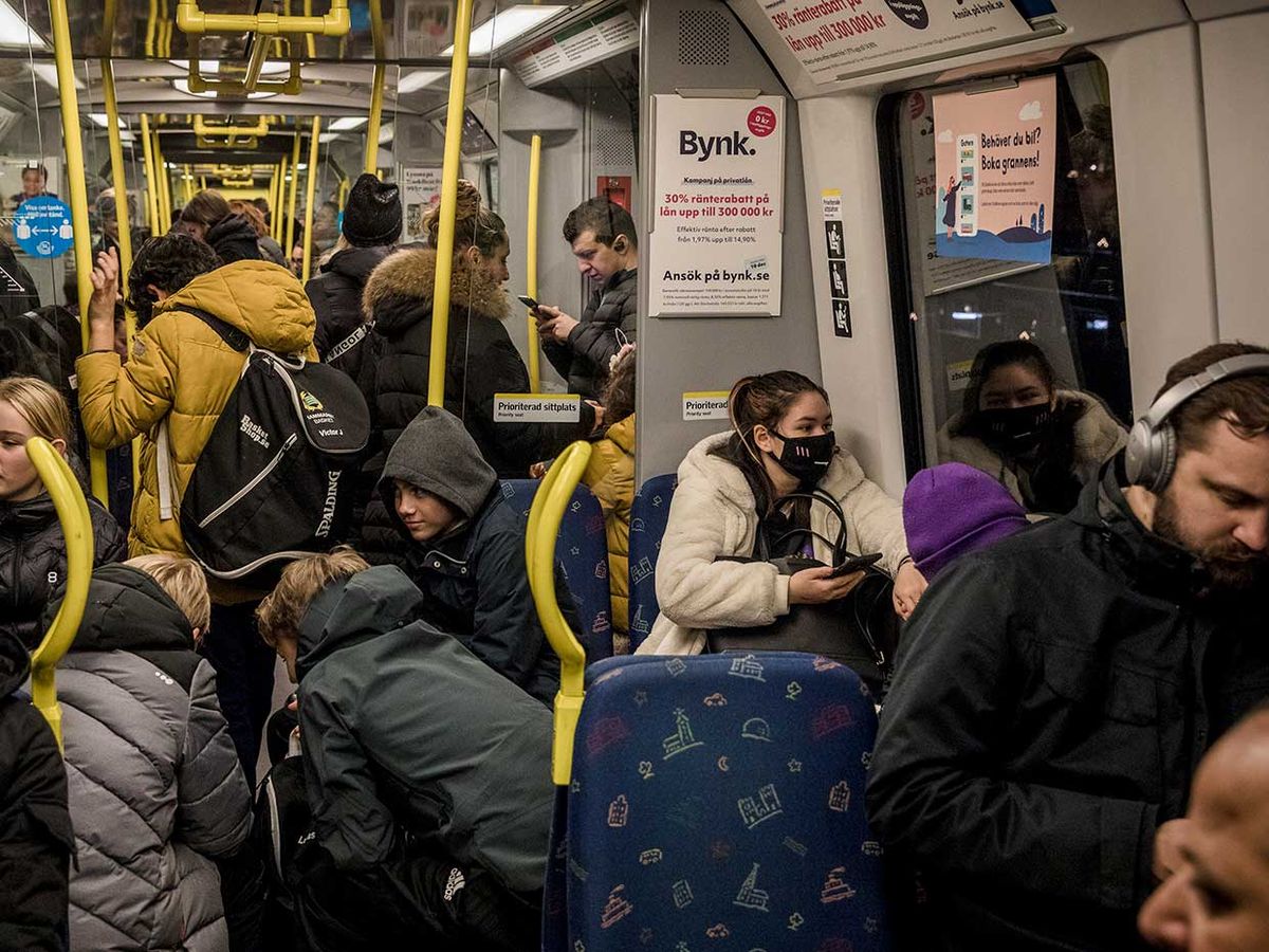 Passengers are crammed into a packed subway car in the middle of the ongoing Covid-19 pandemic, on December 4, 2020 in Stockholm, Sweden.