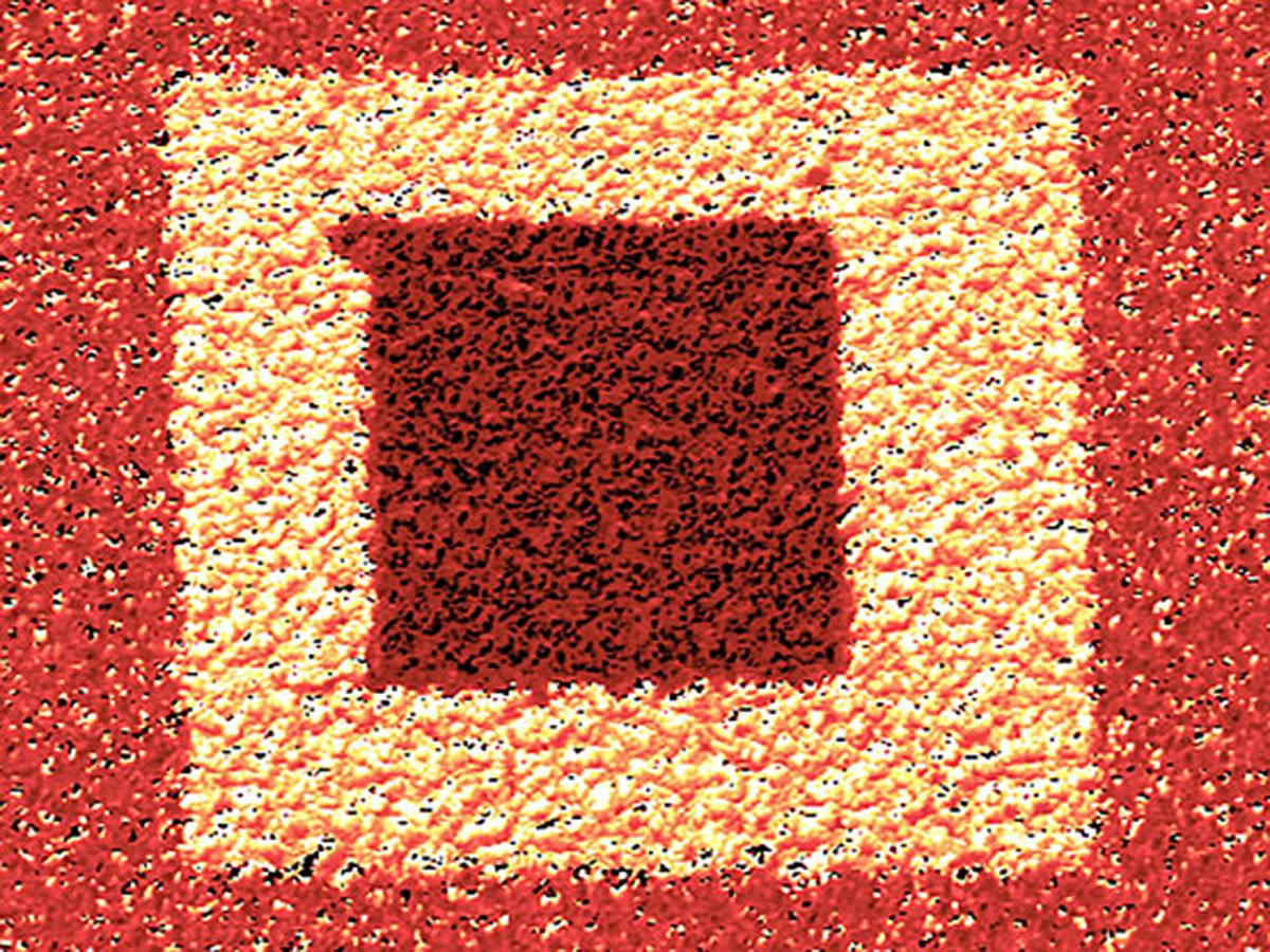 PFM phase image of a 400 nm thick BiFeO3 (BFO) ferroelectric film, which looks like a light orange square inside of a red rectangle. 