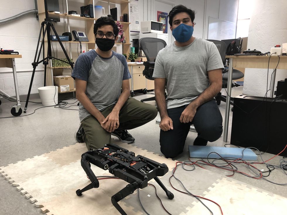 PhD students Avadesh Meduri and Paarth Shah working on a quadruped robot in Ludovic Righettiu2019s Machines in Motion Laboratory.