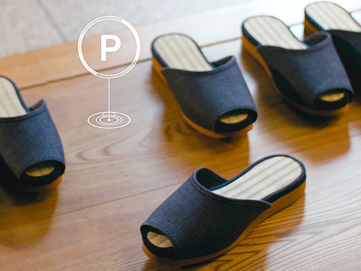Photo-illustration of Nissan's self-parking hotel slippers.