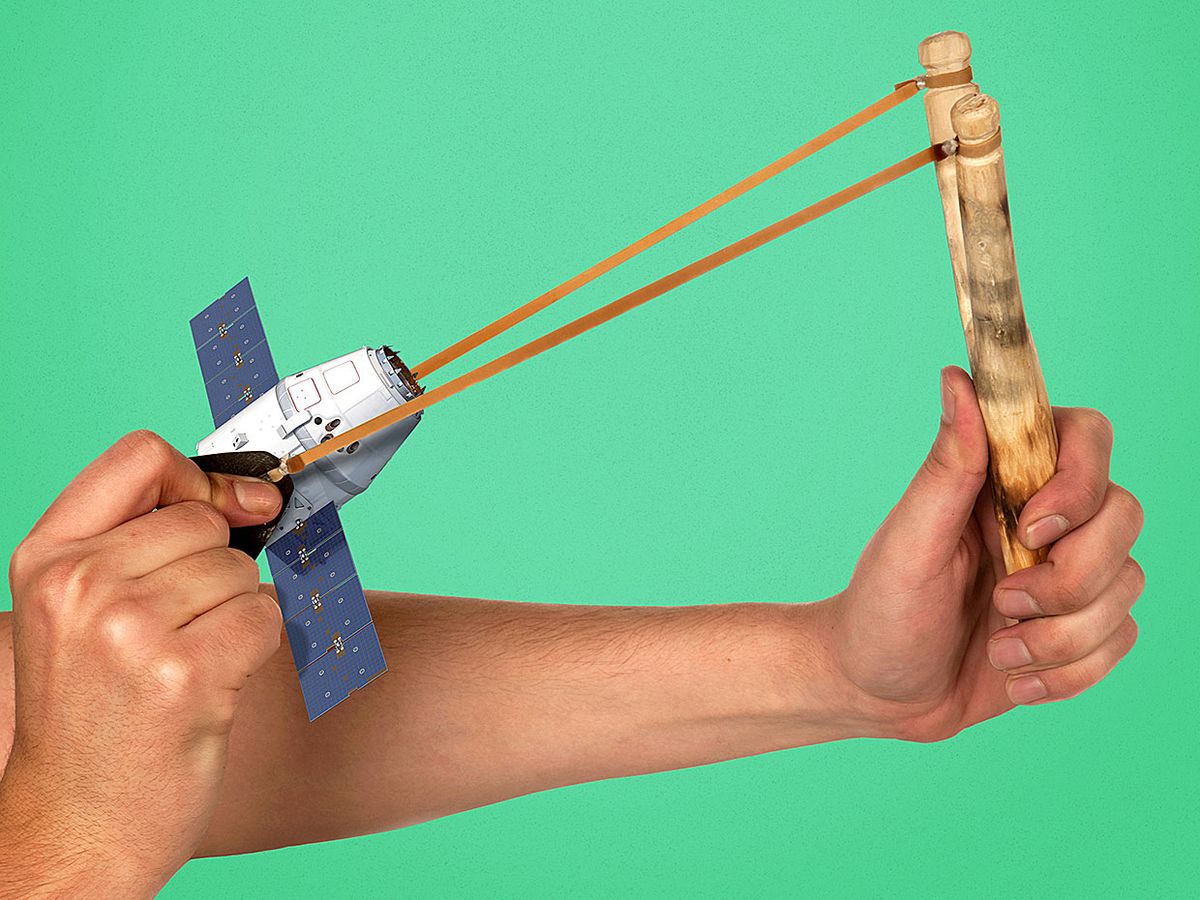 Photo illustration of person holding slingshot about to sling replica of a small geo satellite.
