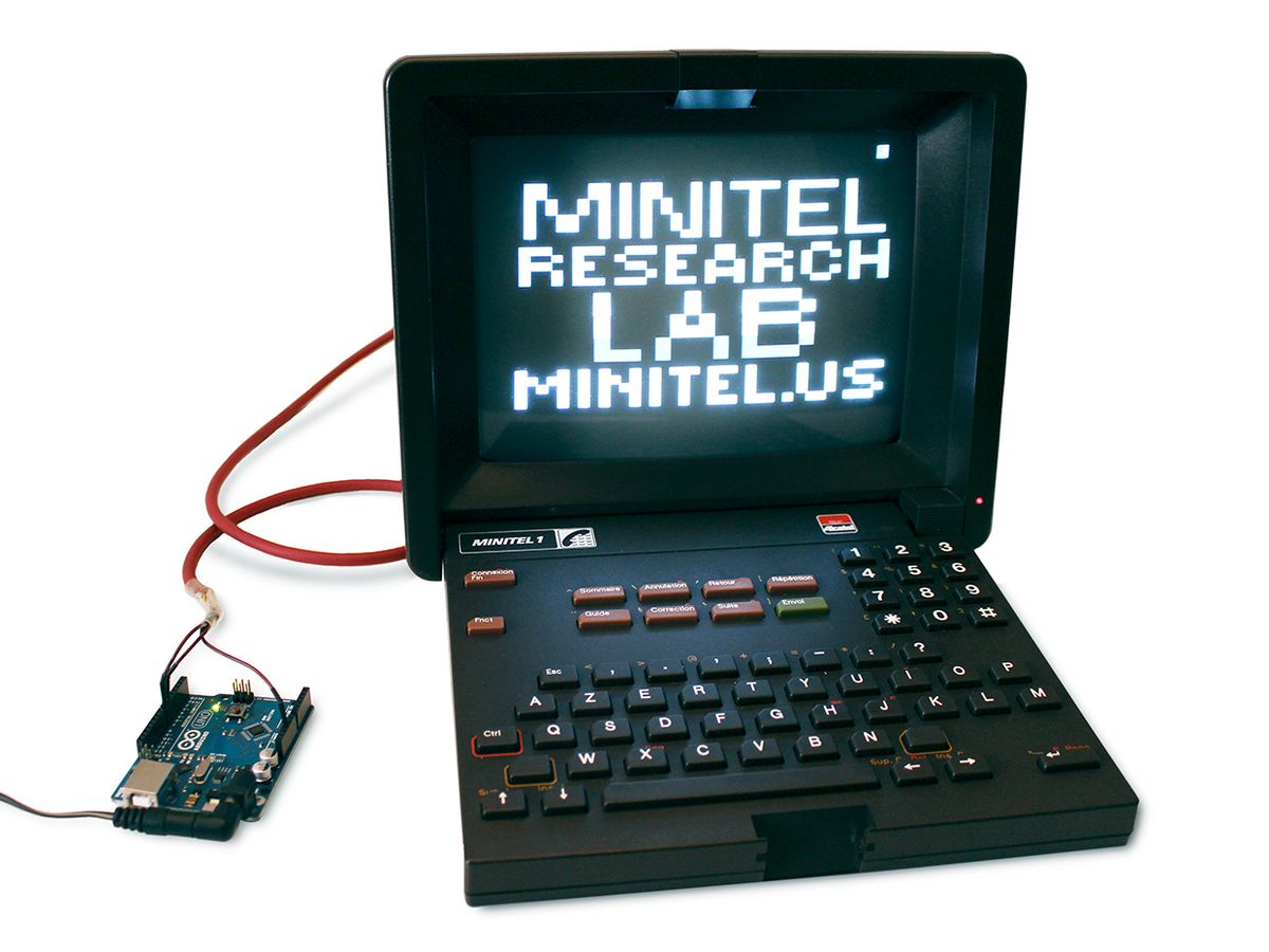 Photo of a Minitel device with wire attached to a circuit board.