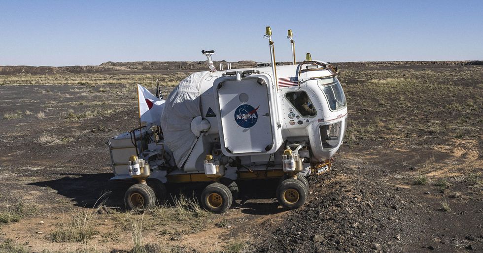 Photo of a NASA moon rover in a desert.