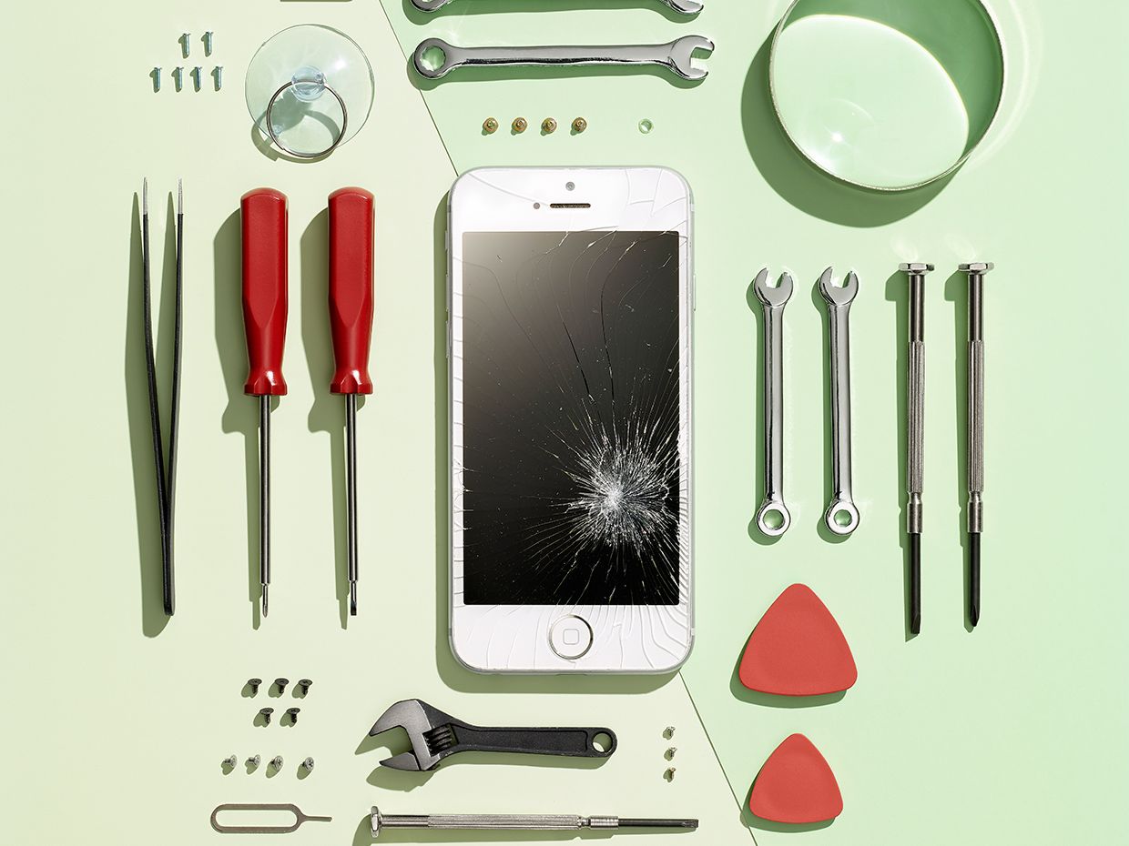 Photo of a smart phone surrounded by tools