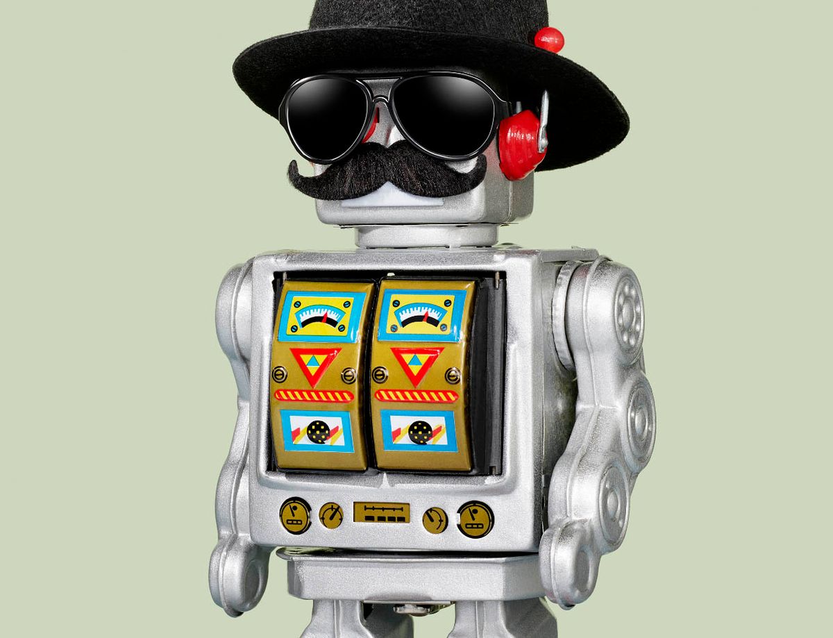 Photo of a toy robot wearing a hat, dark sunglasses and a mustache.