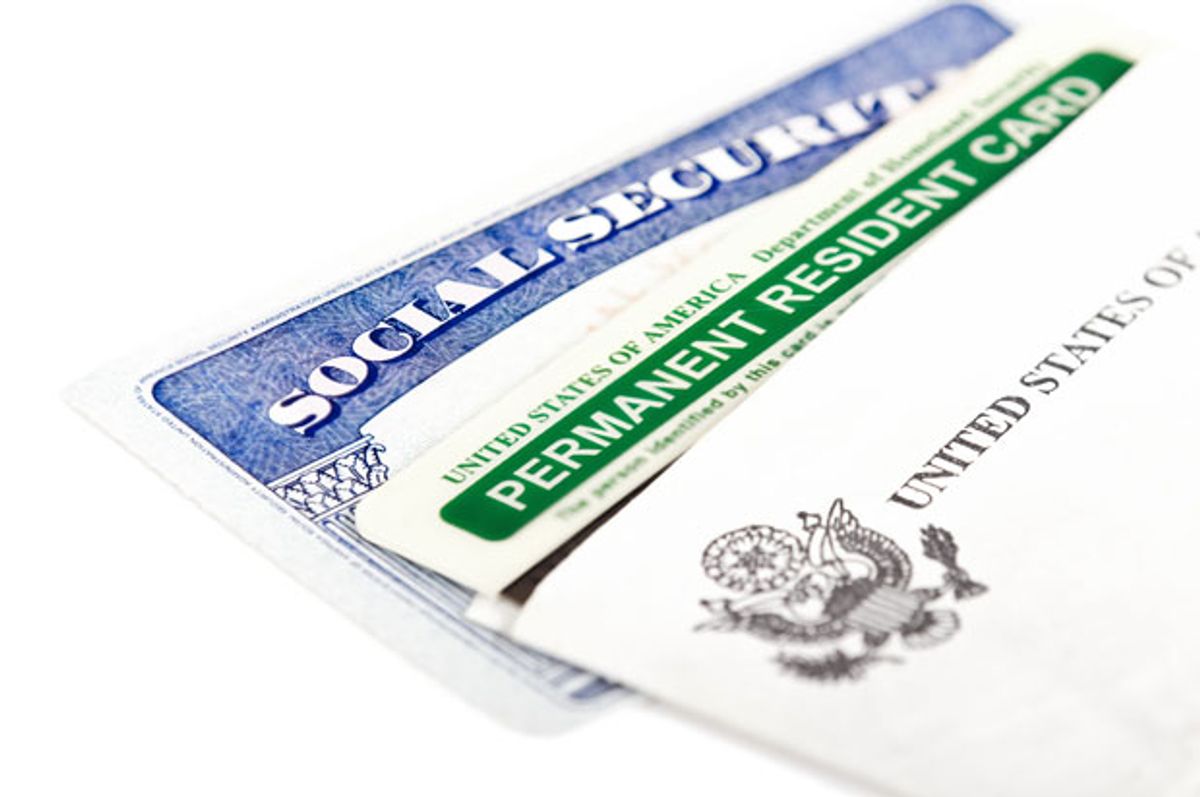 Photo of a two forms of ID and a US logo.