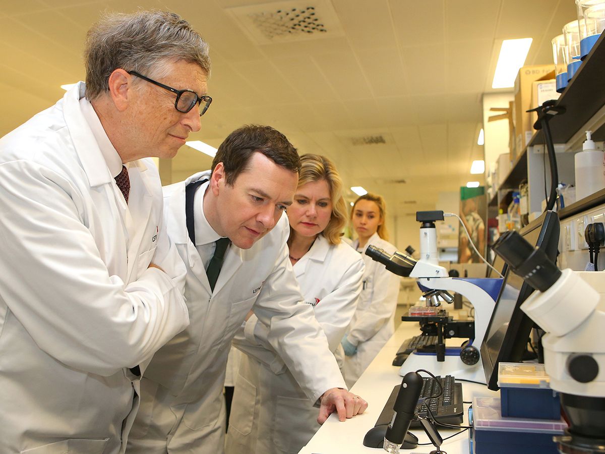 Photo of Bill Gates at the microscope