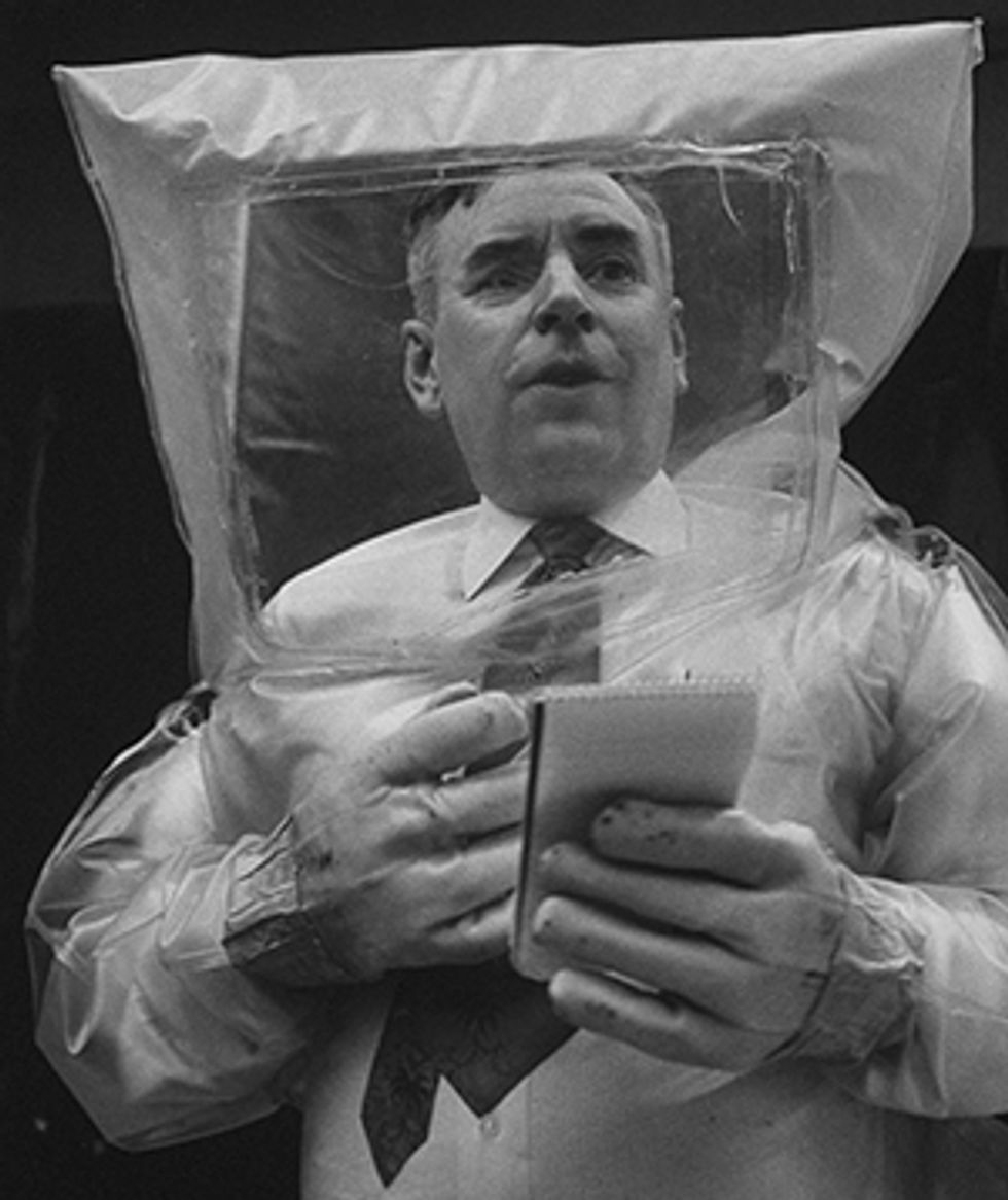 photo of Homer Moulthorp demonstrating inflatable polyethylene suit