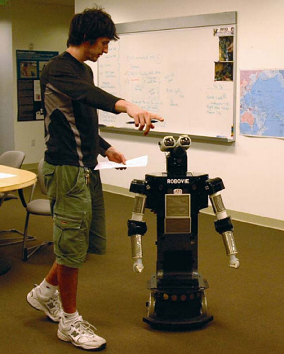 Photo of human with robot.