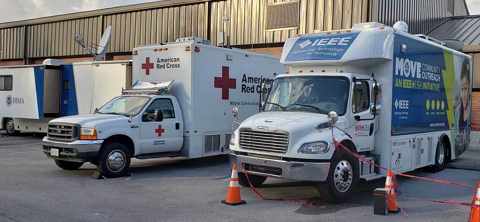 Photo of IEEE MOVE truck and a Red Cross truck