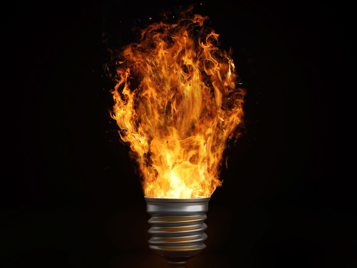photo of light bulb giving off flame
