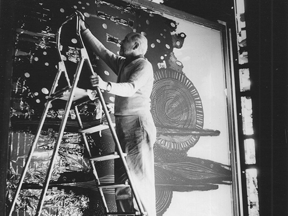 Photo of Malina on ladder, creating "Cosmos" in the summer of 1965.