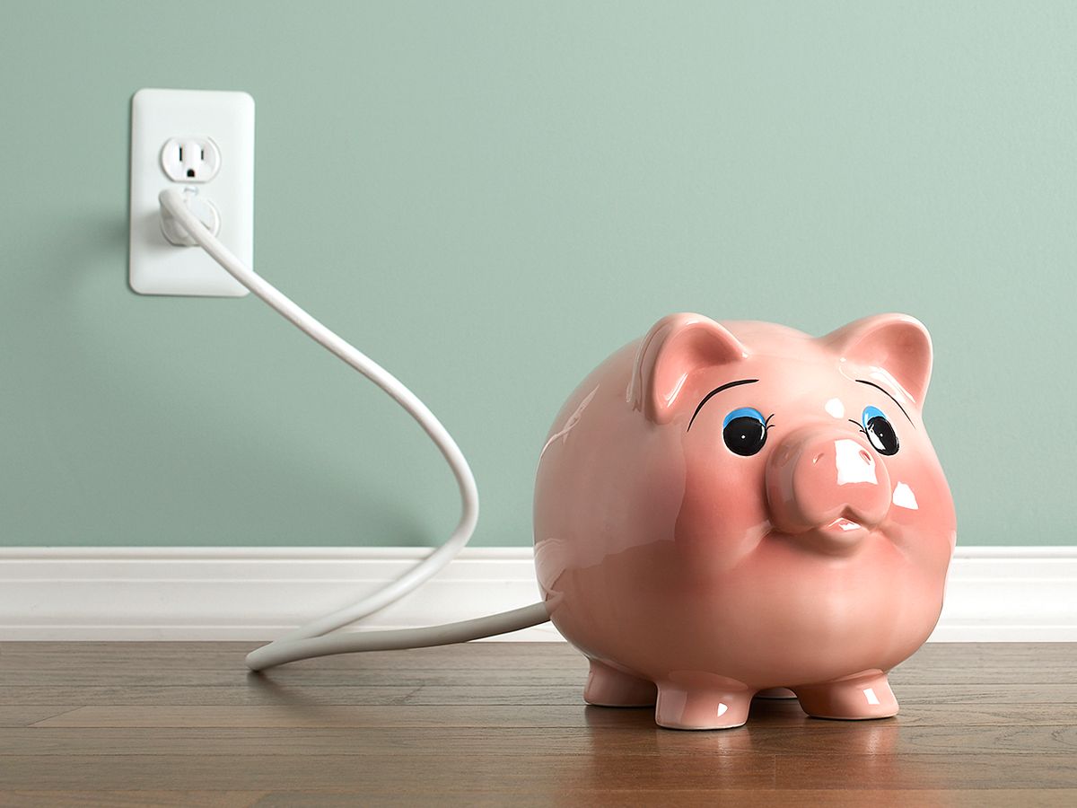 Photo of pink ceramic pig plugged into wall.