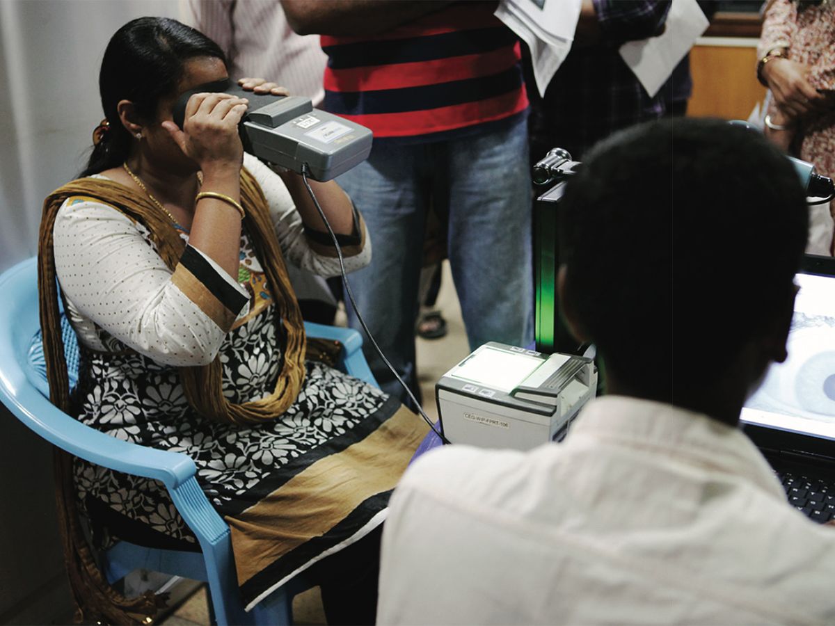 Photo of residents of Bangalore and Delhi, India, being provided with iris scan.