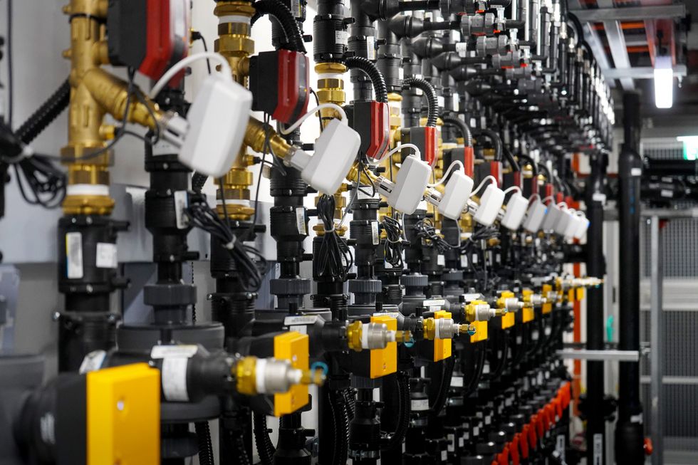 photo of rows of pipes with yellow and white valves
