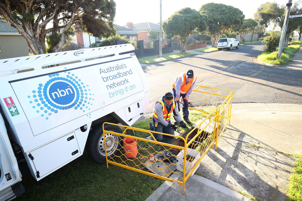 Photo of technicians installing a portion of Australia’s National Broadband Network.