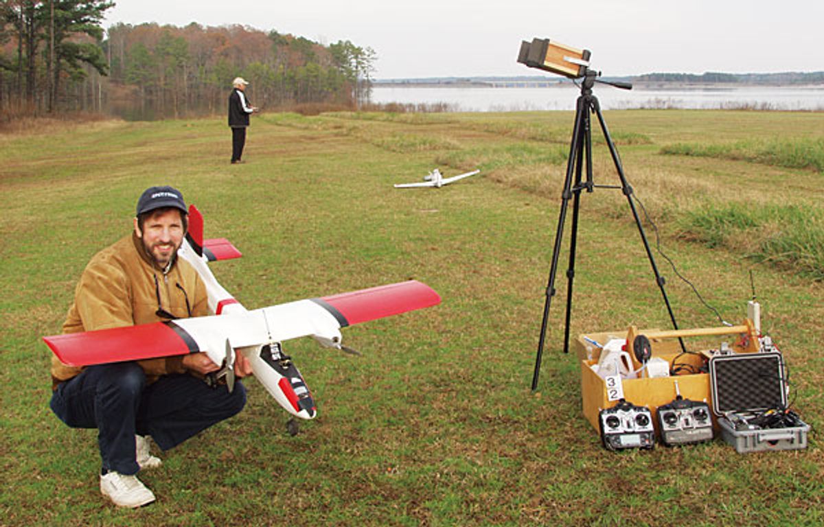 Photo of the author with a video camera and radio downlink to a radio-controlled model airplane