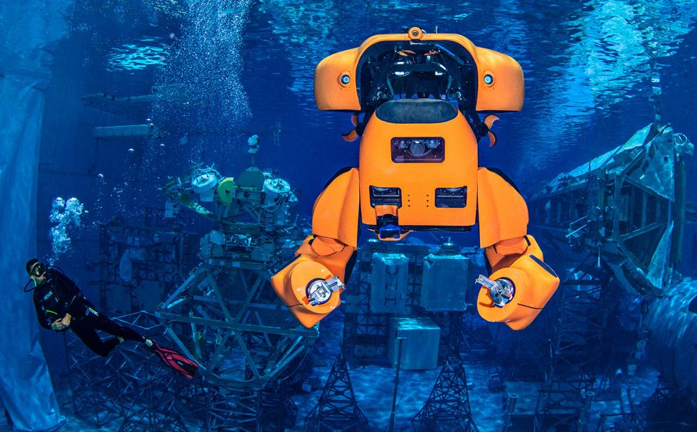 Photo of the robot Aquanaut floats underwater during a test at NASA\u2019s Neutral Buoyancy Laboratory.