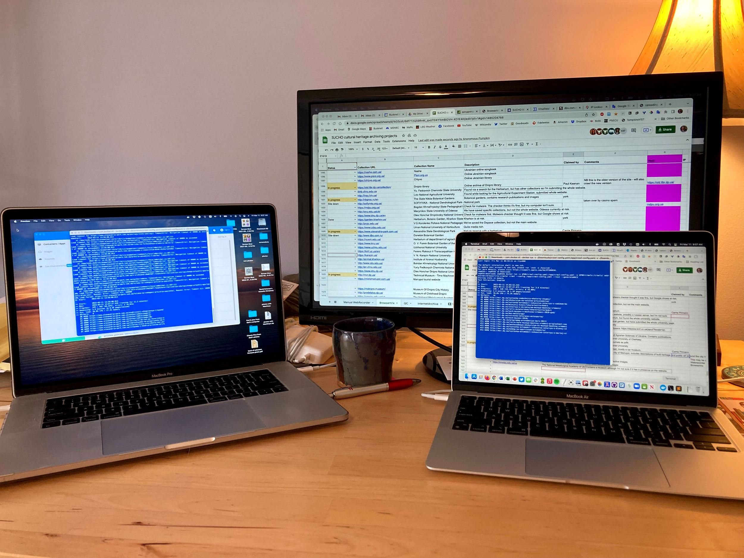 Photo of two laptops, each with UNIX Terminal command windows open