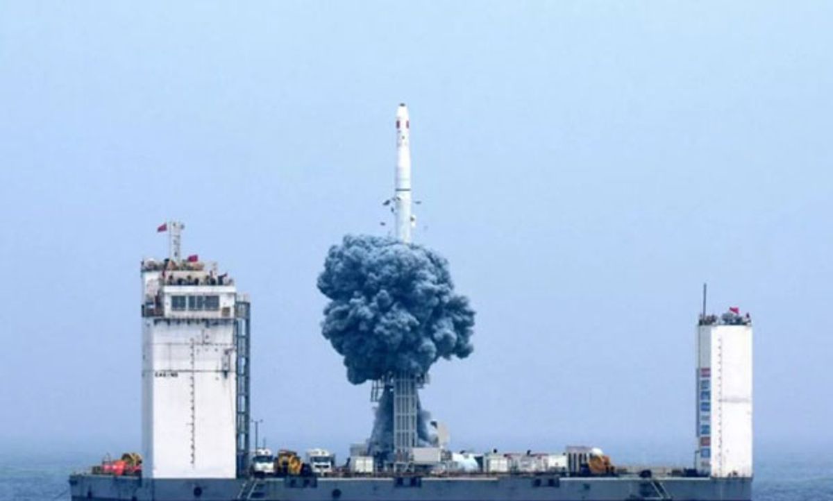 Photo showing liftoff from a mobile platform in the Yellow Sea.