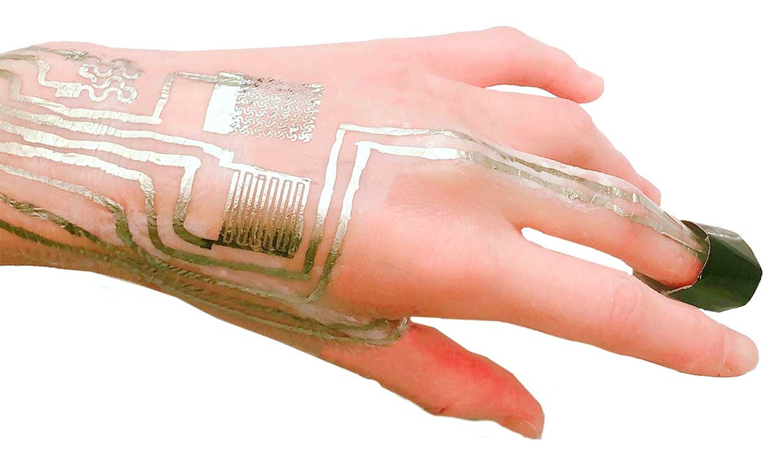 Photograph of a hand with on-body sensors, such as electrodes and temperature sensors, which were directly printed and sintered on the skin surface. On-body sensors, such as electrodes and temperature sensors, were directly printed and sintered on the ski