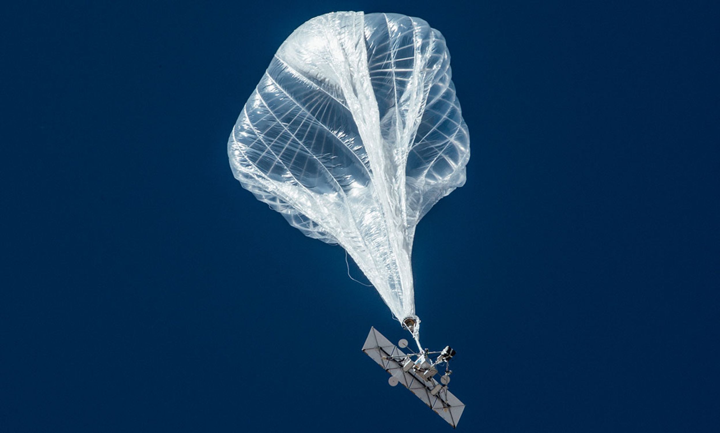 Photograph of a Loon balloon in the air.