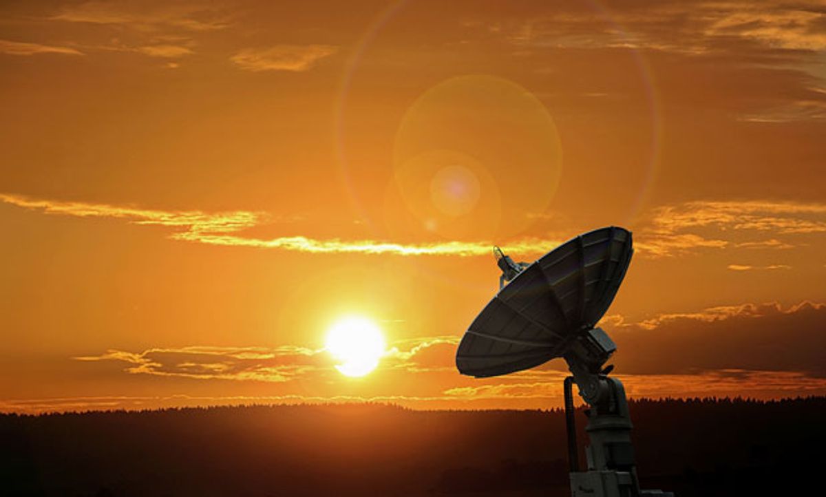 Photograph of an Amazon Web Services satellite during sunset.