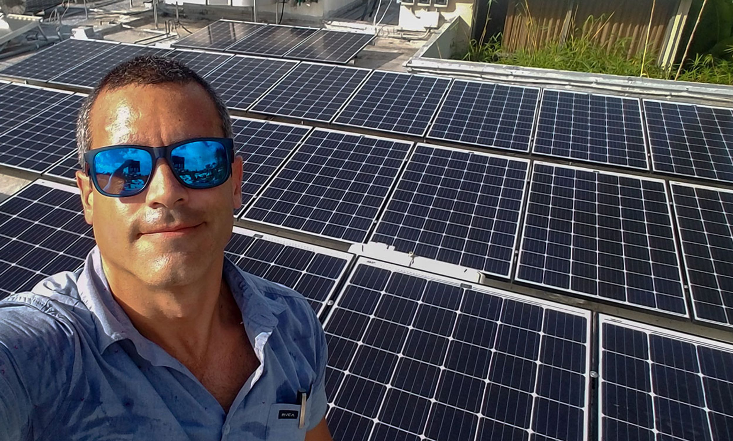 Photograph of Gabriel Rivera at a solar installation in Puerto Rico.