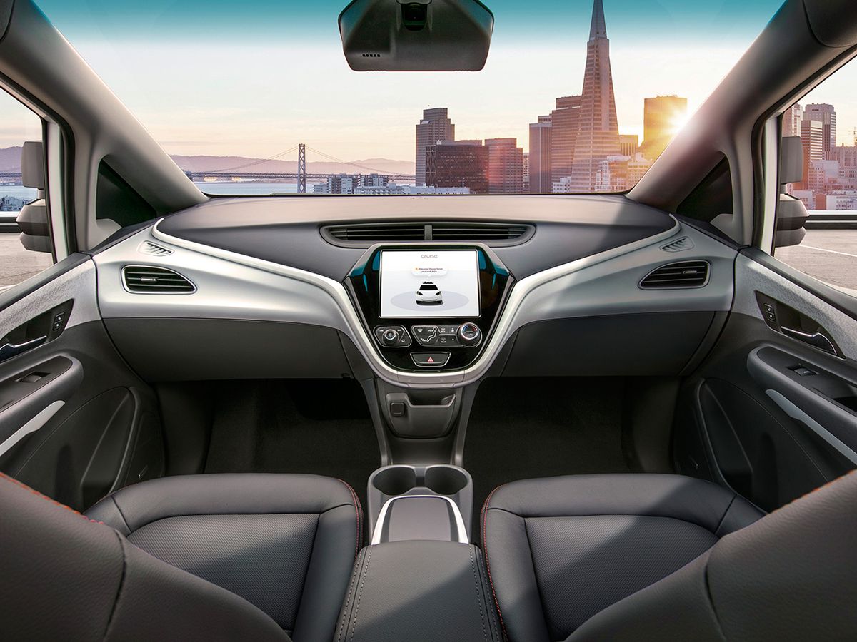 Photograph showing the steering wheel-free view inside of GM’s Cruise self-driving car.