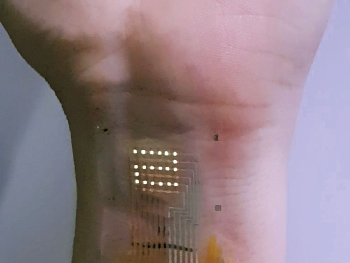 Photographic image of ultrathin AM-OLED display on the human wrist