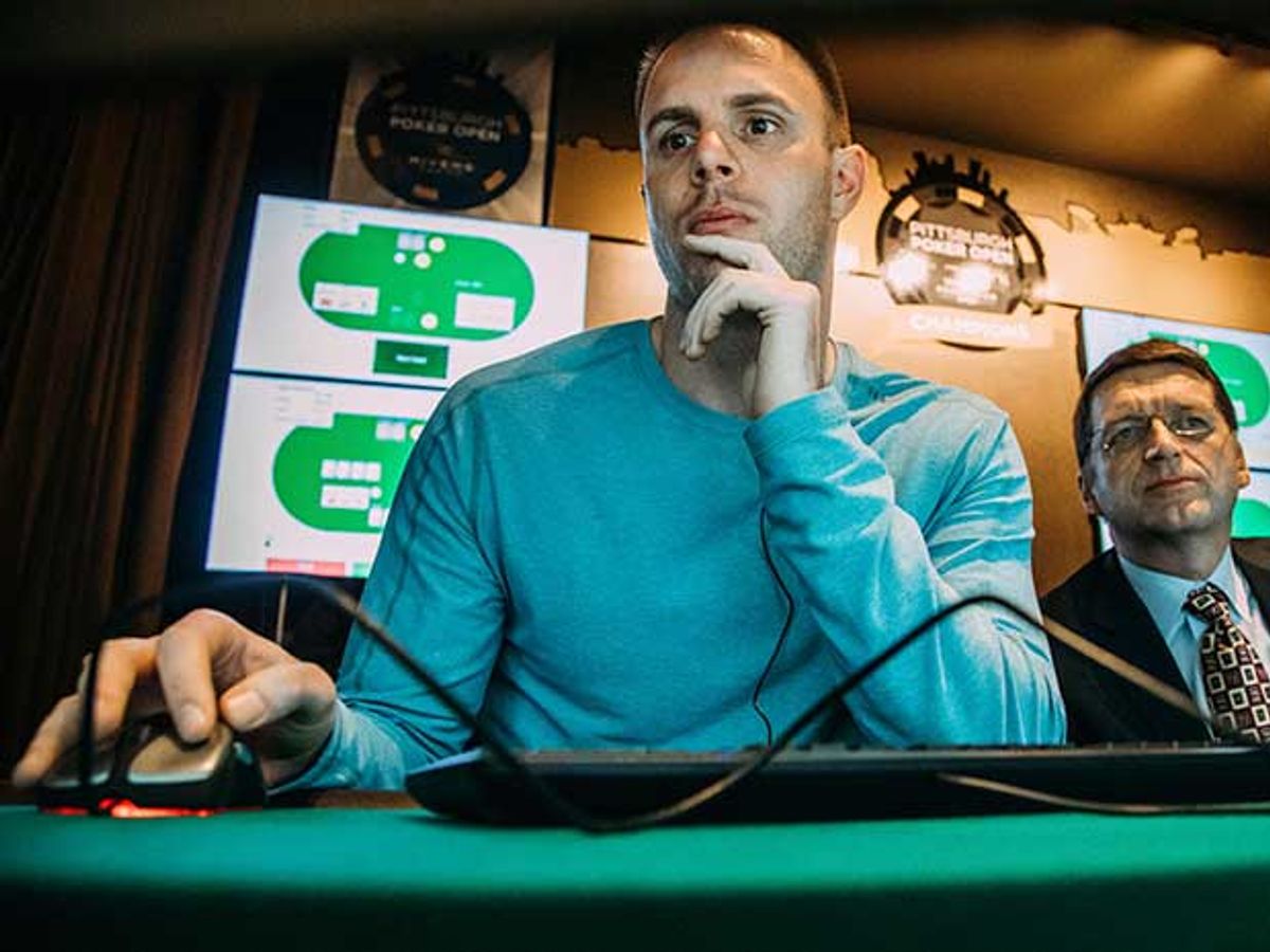 Poker pro Jason Les with computer mouse in hand plays against the Libratus AI