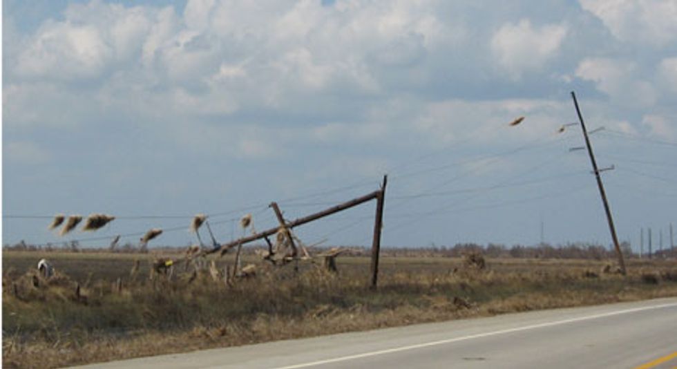 Poles snapped by Ike brought down the only power line serving the Bolivar Peninsula.