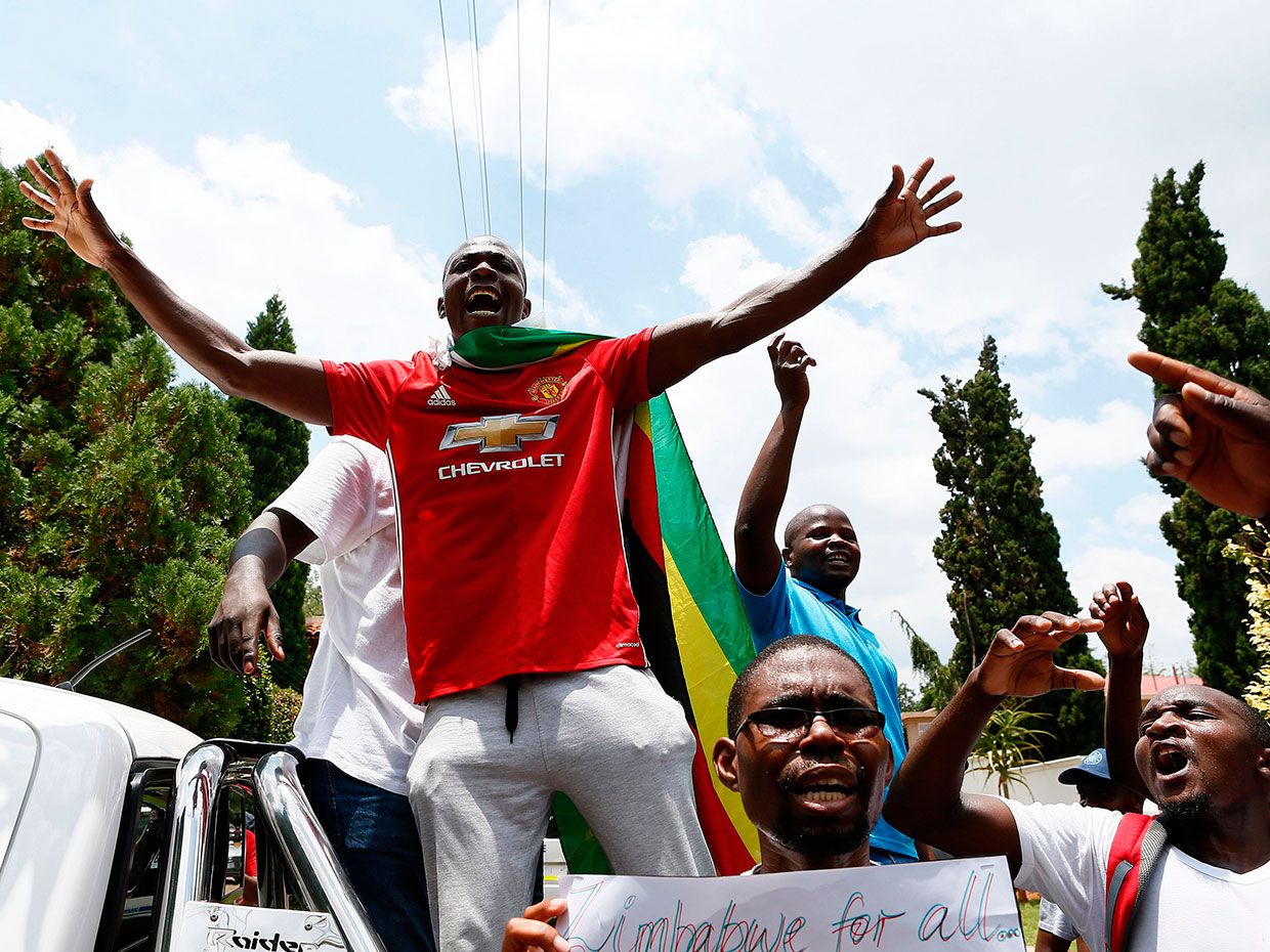 Protesters sing during a demonstration outside the Zimbabwean Embassy in Pretoria on January 16, 2019.