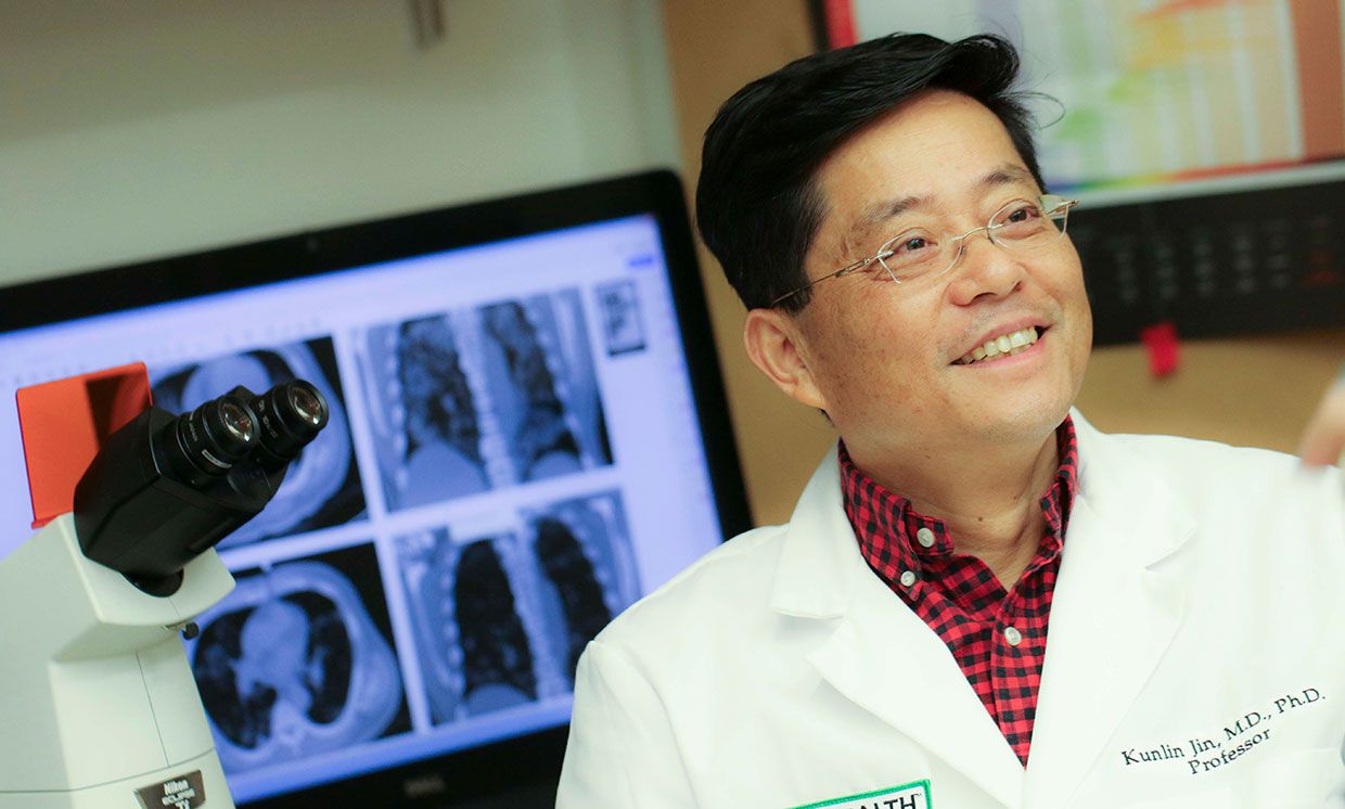 Researcher Kunlin Jin works with stem cells in his lab at the University of North Texas Health Science Center. 